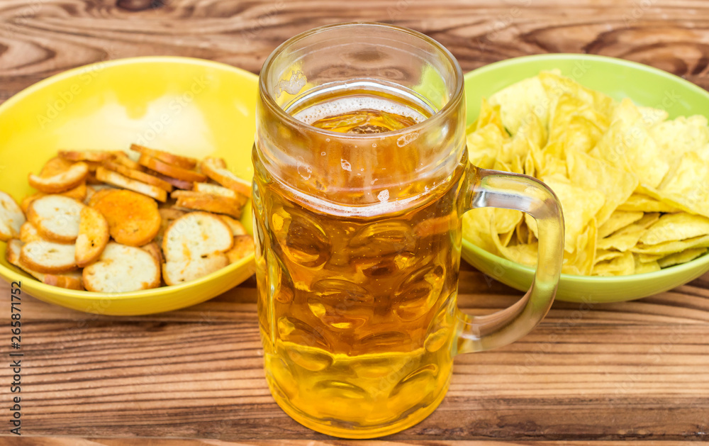 Beer with snacks for beer on wooden table. Beer with snacks for beer on wooden table.