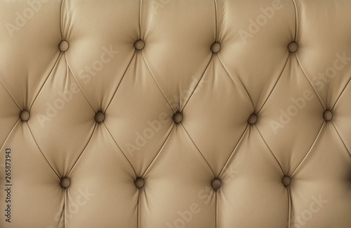 texture of sofa upholstery, armchairs. Leather sofa, leather chair. retro furniture surface. .yellow, red, beige