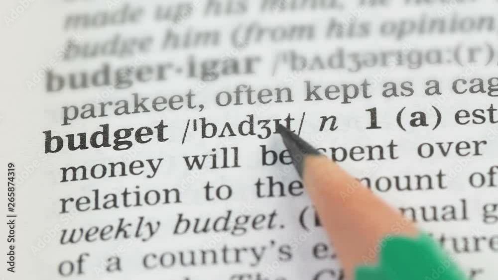 Budget, pencil pointing word on vocabulary page in english, savings planning Budget, pencil pointing word on vocabulary page in english, savings planning