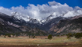 Panoramic view of Rocky Mountain National Park, beautiful landscape of snow capped mountains and open valley meadow