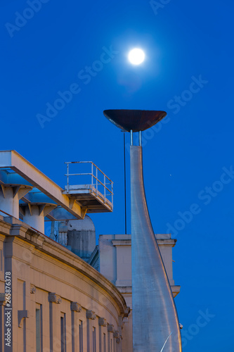 moon posing as a Olympic flame at Barcelona stadium photo