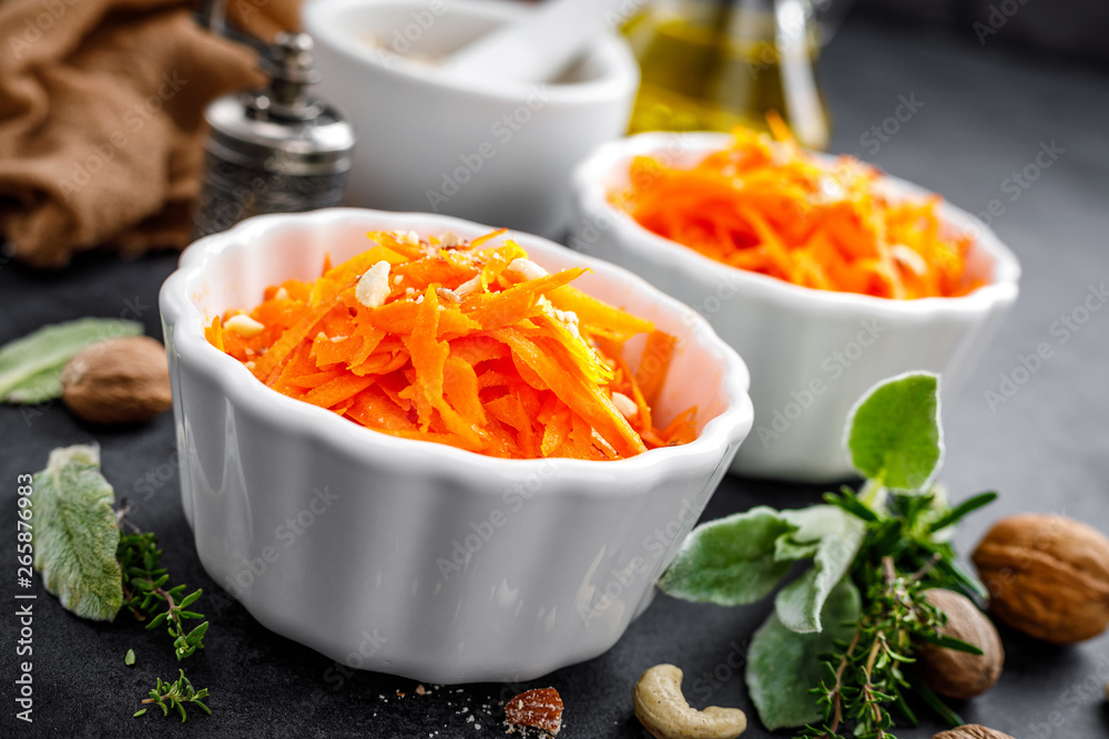 Fresh carrot salad with oil and nuts Fresh carrot salad with oil and nuts