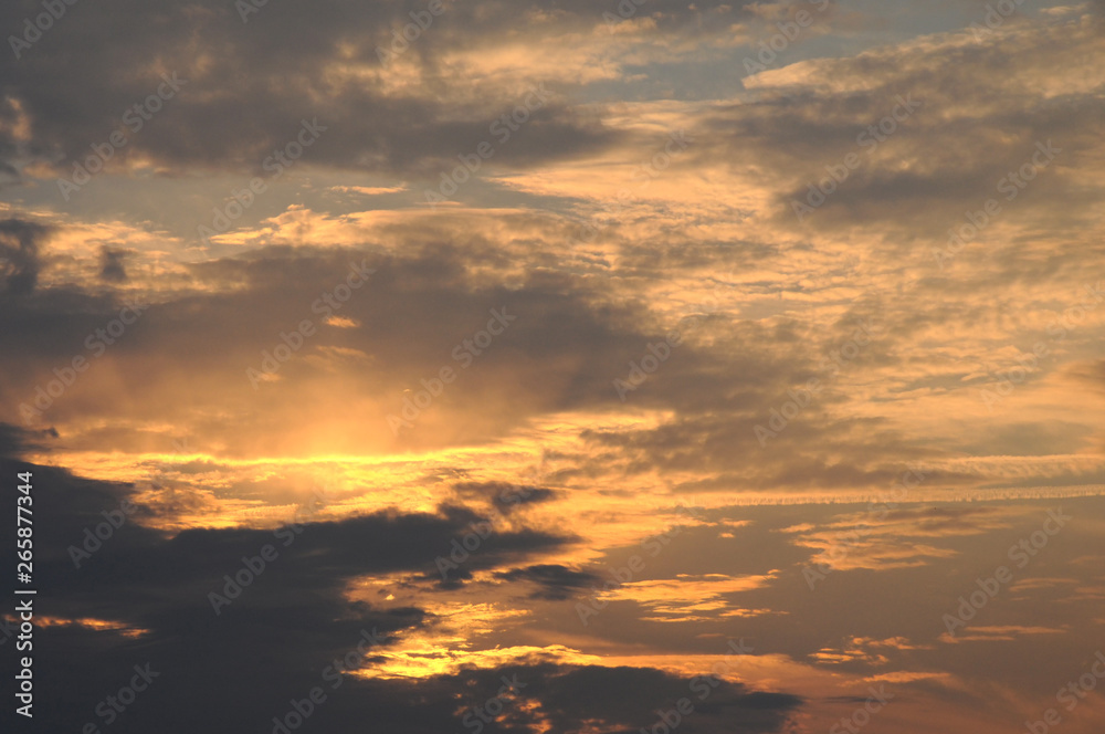 Dramatic sunset sky background with fiery clouds