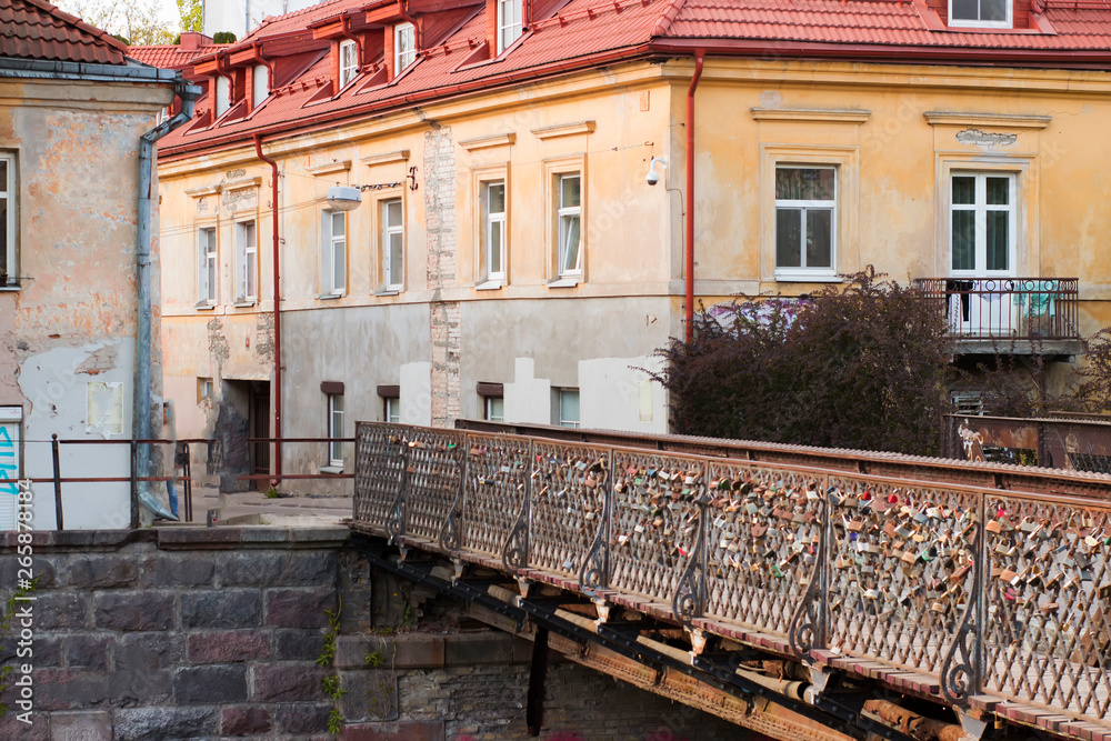 Authentic District in Lithuania, Užupis. Old architecture buildings and love bridge