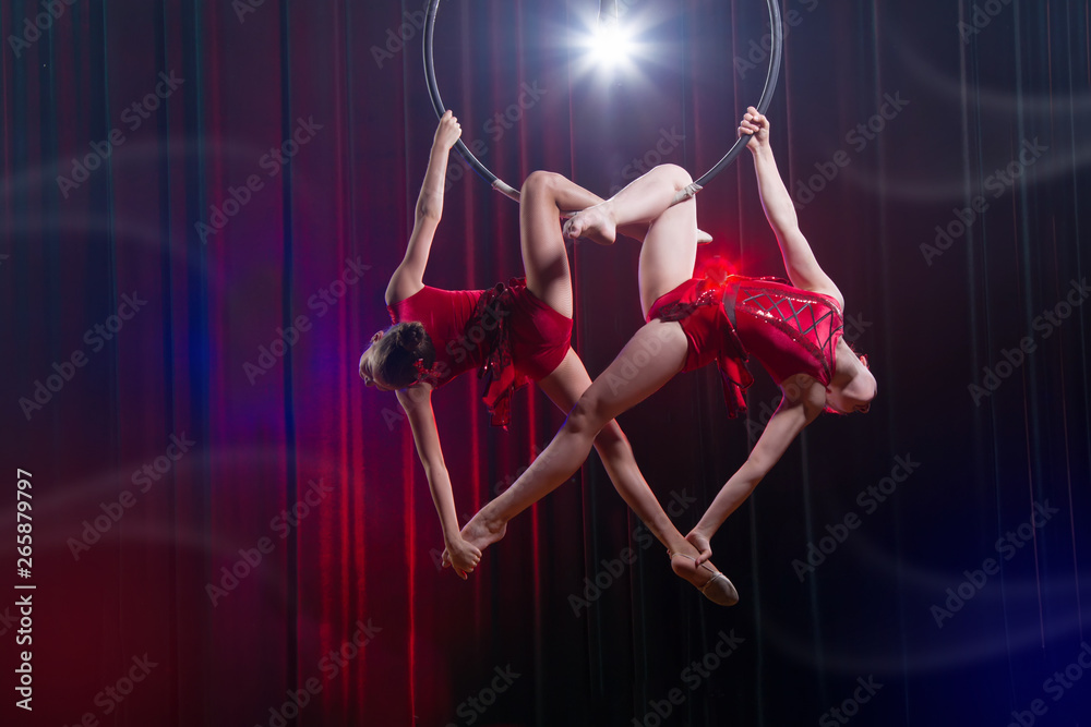 Circus actress acrobat performance. Two girls perform acrobatic ...