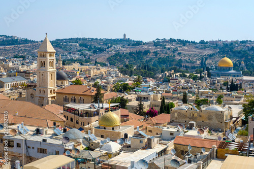 Israel, Jerusalem District, Jerusalem. The bellower of the Lutheran Church of the Redeemer and buildings in the Old City. photo