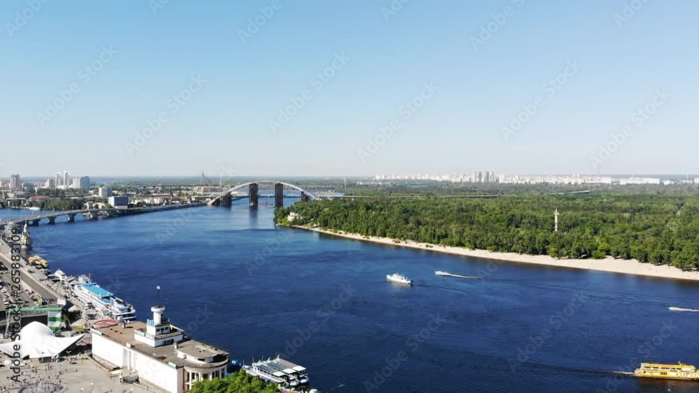 Beautiful panoramic view of the river in big modern metropolis in sunlight. Stunning modern cityscape and nature. Beautiful panoramic view of the river in big modern metropolis in sunlight. Stunning modern cityscape and nature.