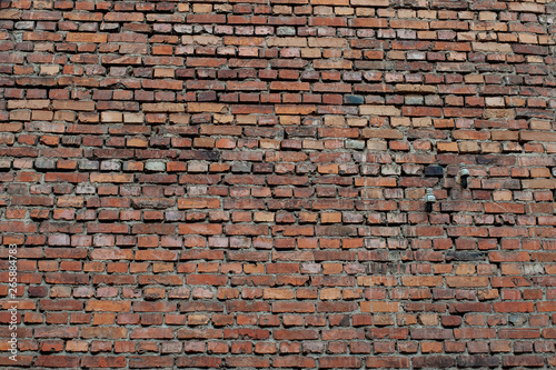 Big brick wall. Cool texture of stonewall. Brown color.