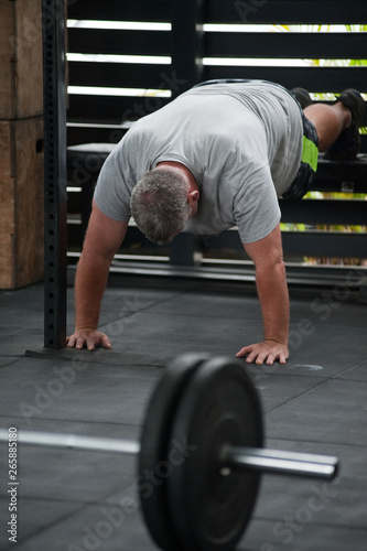 Man doing inverted pushups 