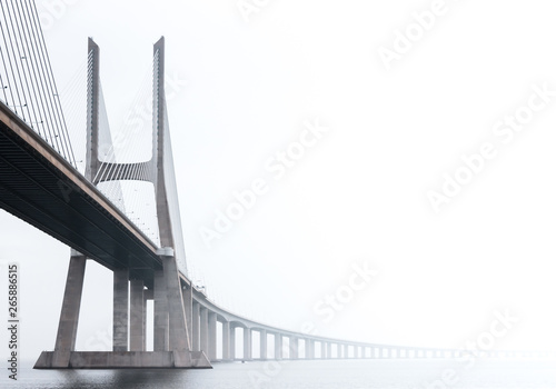 Ponte Vasco da Gama, Lisbon on a misty morning in March. Large concrete bridge across River Tagus, Portugal