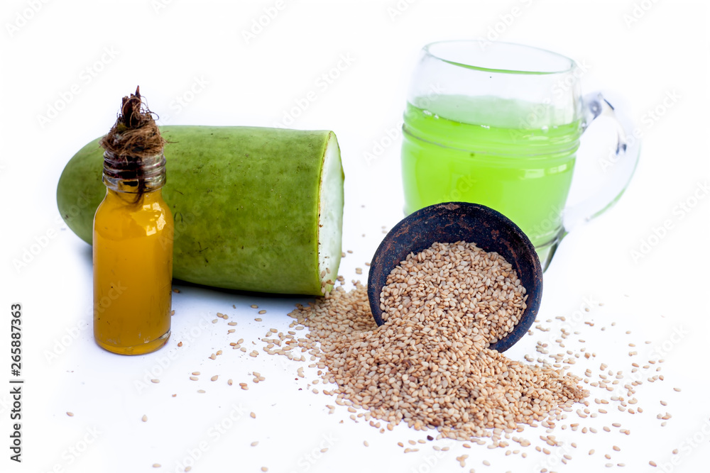 Best treatment to reduce Grey hair isolated on white . Bottle gourd oil  well mixed with sesame seed  bottle gourd and sesame seed also  present. Stock Photo | Adobe Stock