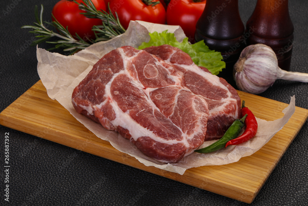 Raw pork neck steak