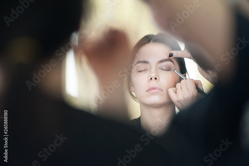 Make up process of beautiful young woman