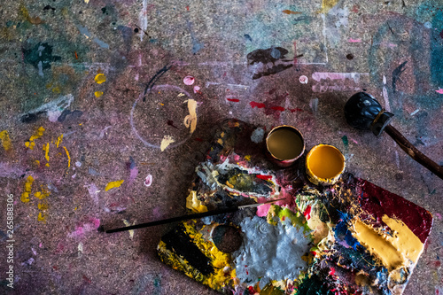 High angle close up of painter's palette and paintbrush in a workshop.,Signwriter