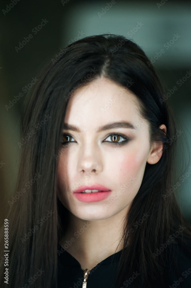 Close up portrait of beautiful young brunette woman 