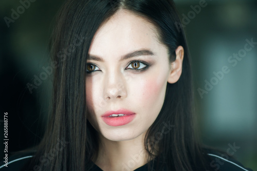 Close up portrait of beautiful young brunette woman 