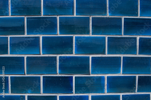 Blue tiles on the wall of a building
