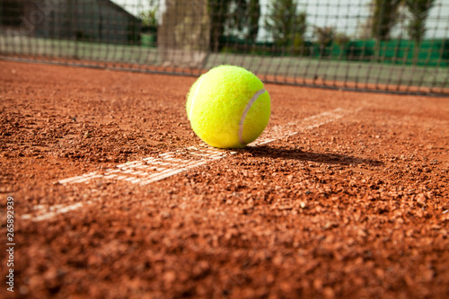 Tennis ball with racket on court  © busra