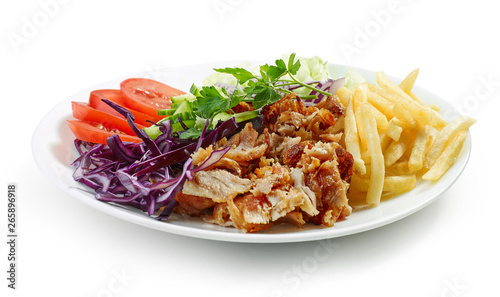 plate of chicken kebab and vegetables photo