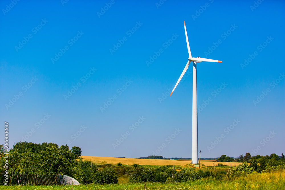 Alternative energy resource. Wind turbine situated on outskirts