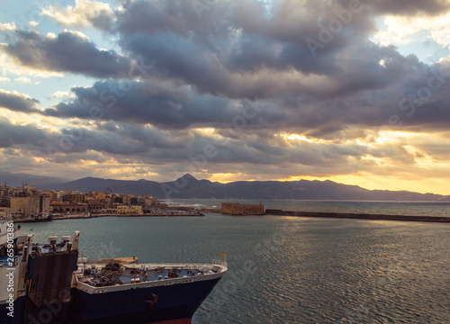 heraklion port view from above parked commercial ship old port koules venetian fort photo