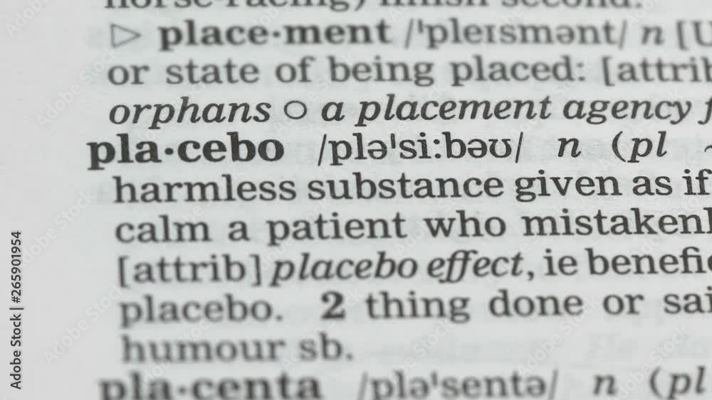Placebo, pencil pointing word in dictionary, harmless pills, scientific studies Placebo, pencil pointing word in dictionary, harmless pills, scientific studies