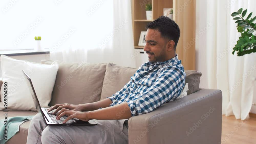 household, housework and technology concept - indian man with laptop computer, mop and bucket after home cleaning household, housework and technology concept - indian man with laptop computer, mop and bucket after home cleaning
