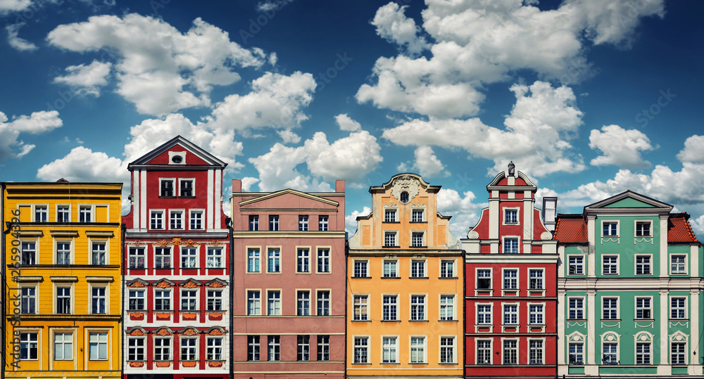 Colorful facades of historic buildings against the sky in the historic old town of Wroclaw, Poland. Architecture and historic background.