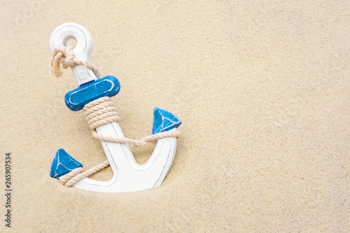 Nautical background with anchor. Anchor in the sand. Frame for a banner text from sand with an anchor