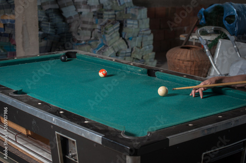 Billiards balls and cue on billiards table. Billiard sport concept