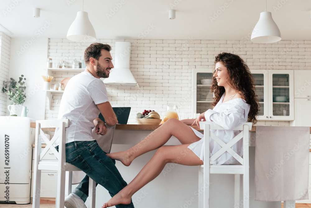 sexy girl in shirt flirting with boyfriend in kitchen sexy girl in shirt flirting with boyfriend in kitchen