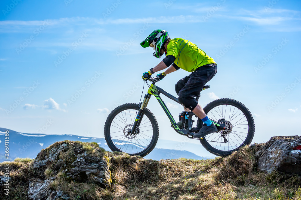 A man is riding enduro bicycle