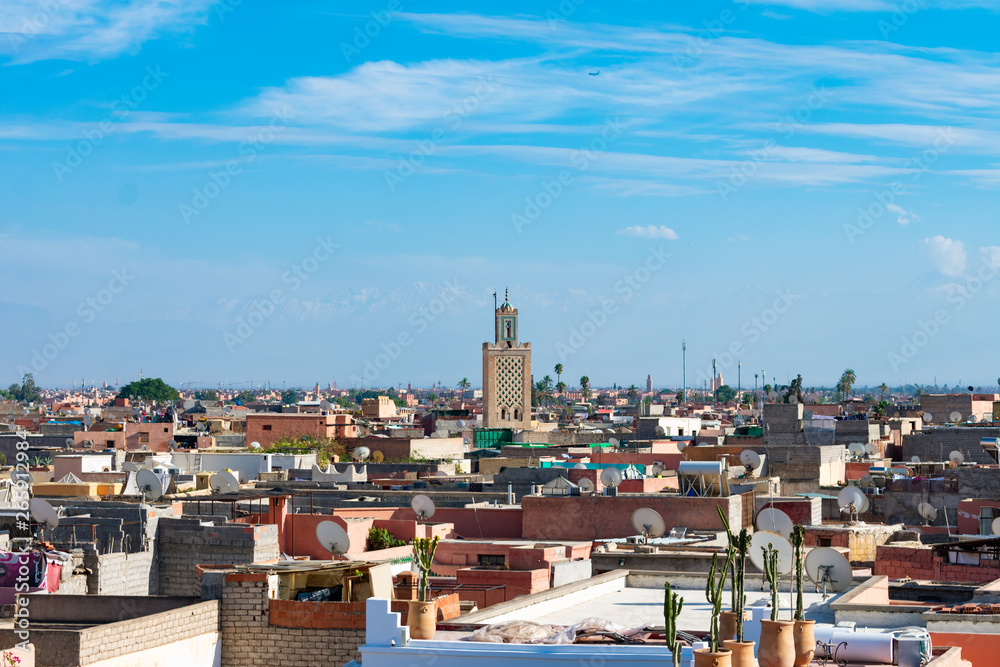 Mosque Minaret in the distance over the Medina of Marrakech Morocco