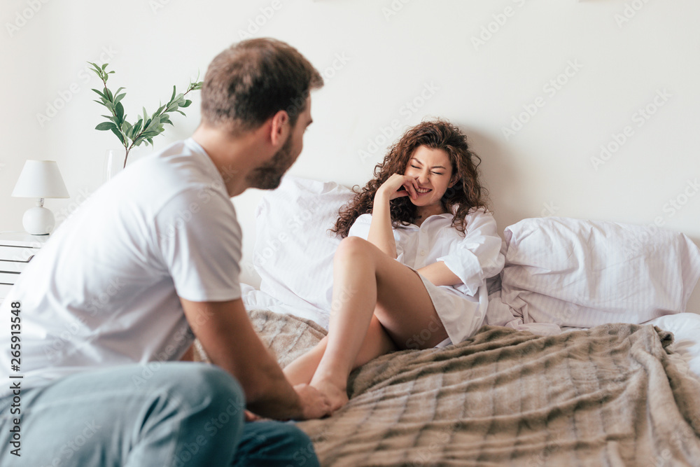 loving couple looking at each other on bed loving couple looking at each other on bed