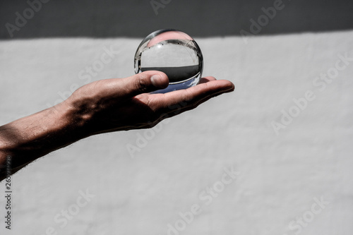 crystal ball in the palm of hand 