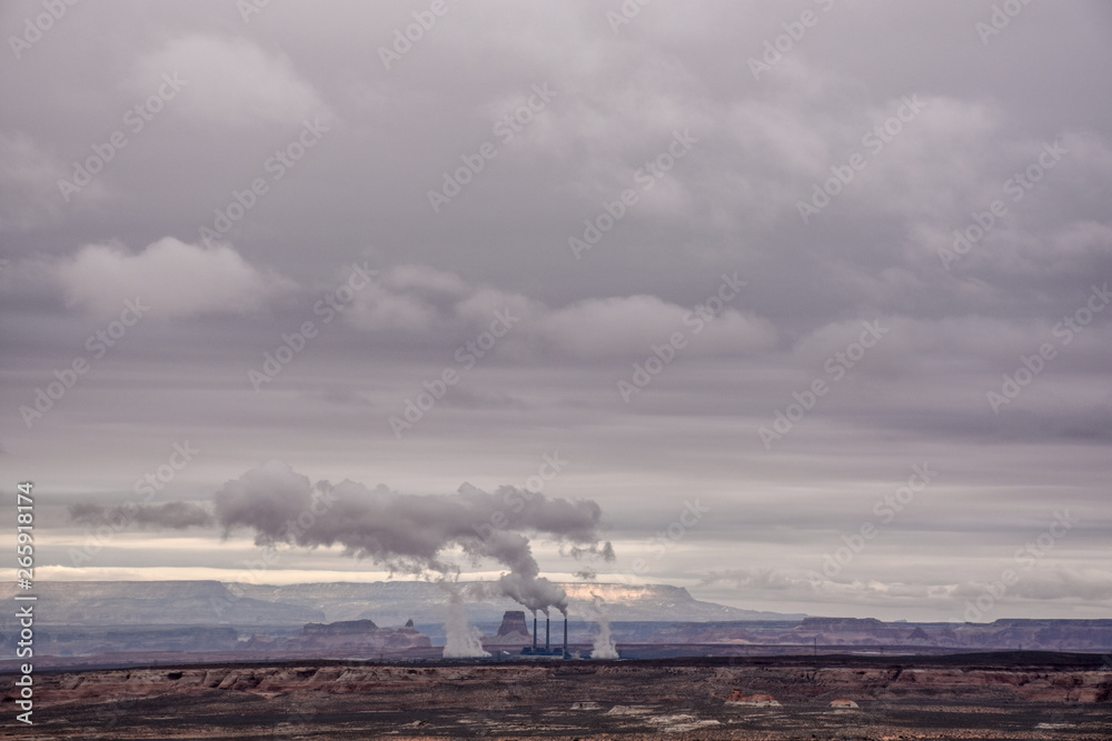 smoke rising from factory in nature landscape 