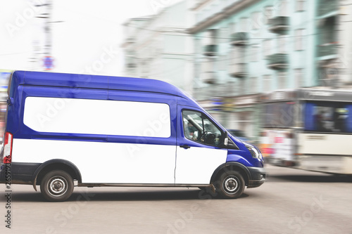 April 13, 2018. Kranoyarsk. Russia. The company's car The Russian Post quickly drives through the city street. Minibus in blue.