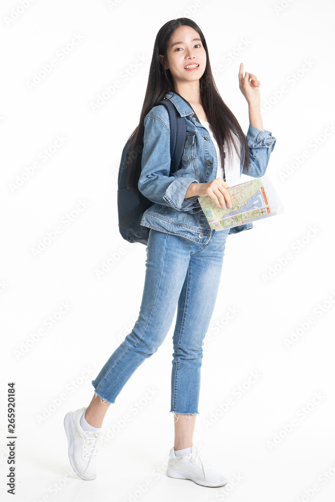 Beautiful young woman smiling and pulling pink colour luggage isolated on white background.Asian woman going to summer vacation.Travel trip funny. Beautiful young woman smiling and pulling pink colour luggage isolated on white background.Asian woman going to summer vacation.Travel trip funny.