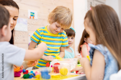 Children with teacher play ...