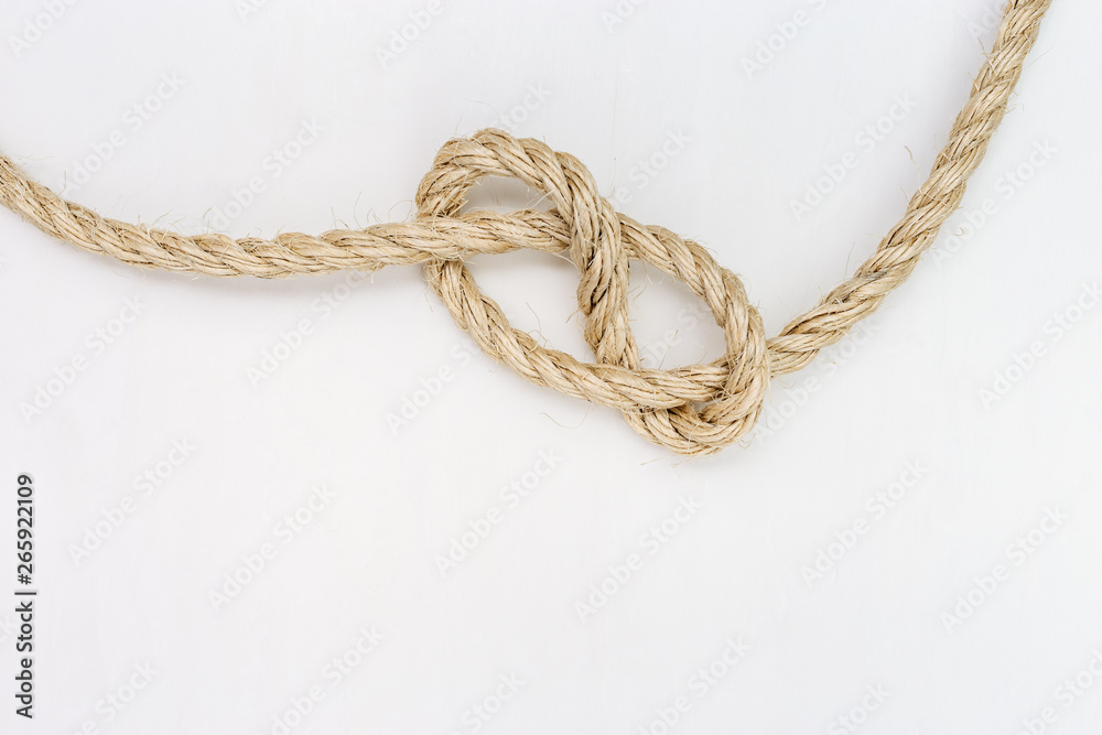 Rope knot on white background. Copy space.