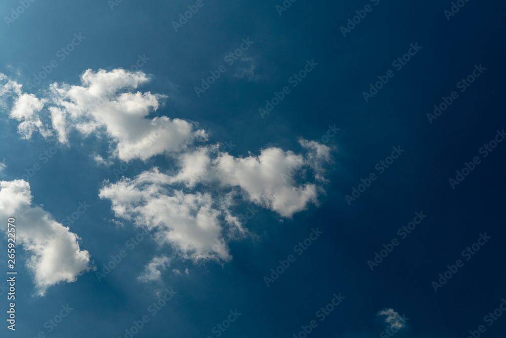 Fototapeta premium Beautiful blue sky with patchy white cloud on tropical weather in summer time background pattern. Skyscape background