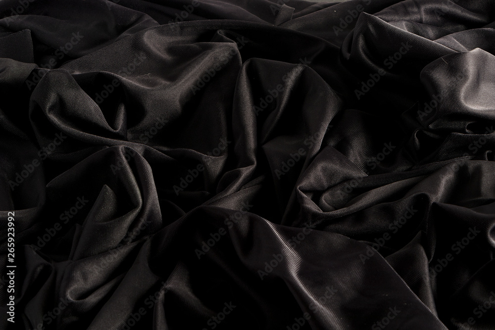 Tela negra brillante con ondulaciones y textura con luz dura y claro oscuro  foto de Stock | Adobe Stock
