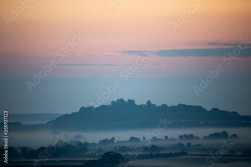 Early morning mist over farmland and woodland in rural Hampshire