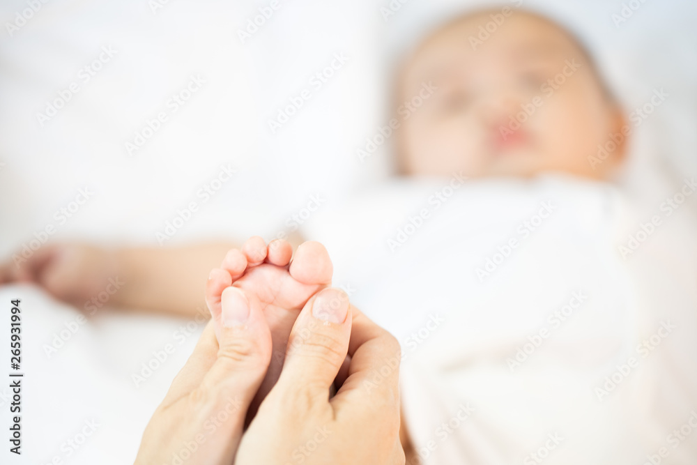 Asian baby happy in the room.Asian baby girl lying down on bed . Asian baby happy in the room.Asian baby girl lying down on bed .