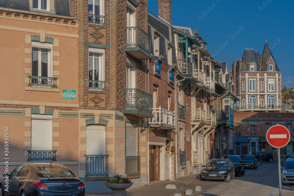 Mers-Les-Bains, France - 04 29 2019: Facades along the dike at sunset