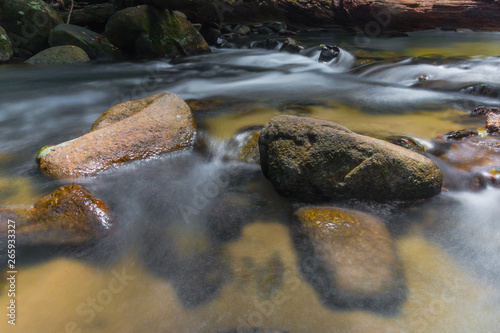 Long exposure shot.Waterfall with rocks in rainforest.