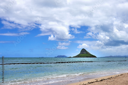 A view of the Chinaman's Hat island seen from a beach near the Kualoa Regional Park at O'ahu, Hawaii.