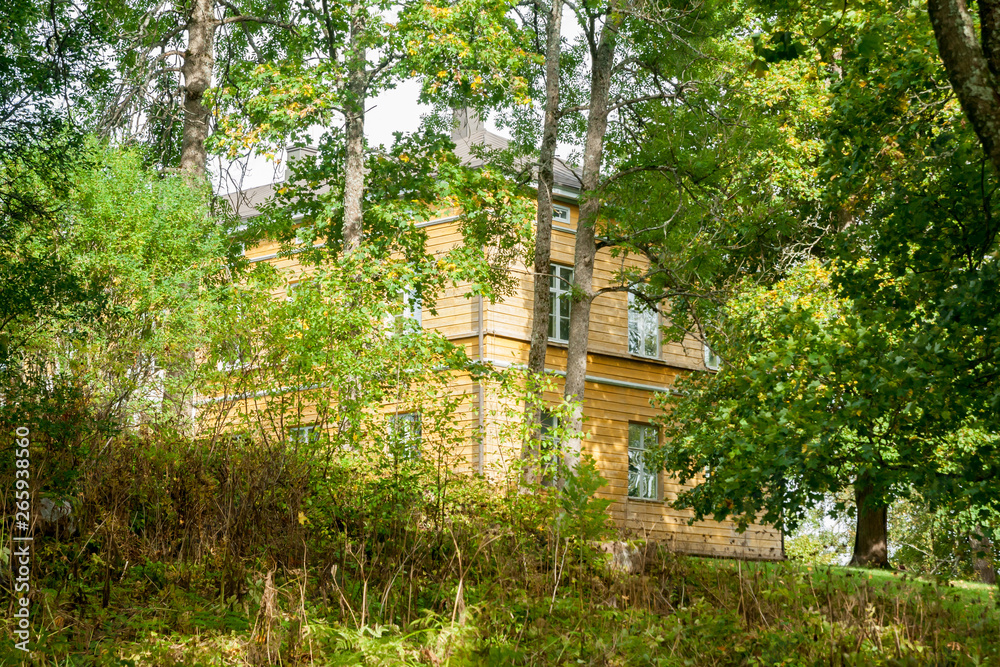 KOUVOLA, FINLAND - SEPTEMBER 20, 2018: Beautiful yellow old building of abandoned Anjala manor. The building was built at the turn of the 19th century and belonged to the Wrede family from 1837. KOUVOLA, FINLAND - SEPTEMBER 20, 2018: Beautiful yellow old building of abandoned Anjala manor. The building was built at the turn of the 19th century and belonged to the Wrede family from 1837.