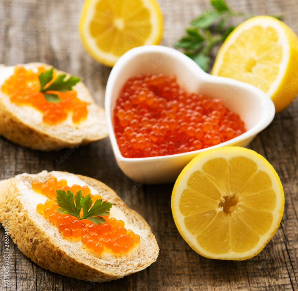 Red caviar in bowl and sandwiches Red caviar in bowl and sandwiches