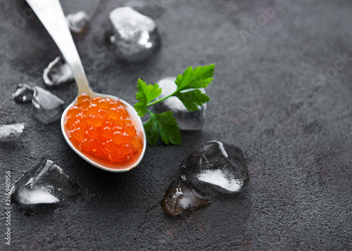 Spoon with delicious red caviars photo